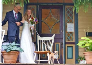 bride with dog on front porch