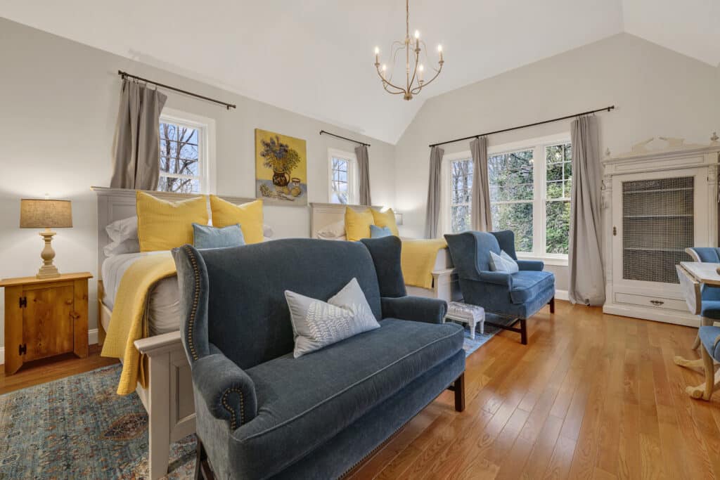 The Highland Room at the South Mountain Inn features two bed and comfortable seating, perfect for a family.